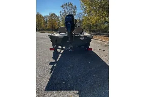 Slide: The Image of 2026 Tracker Bass Tracker Classic Limited boat on a trailer, parked outdoors. - 3