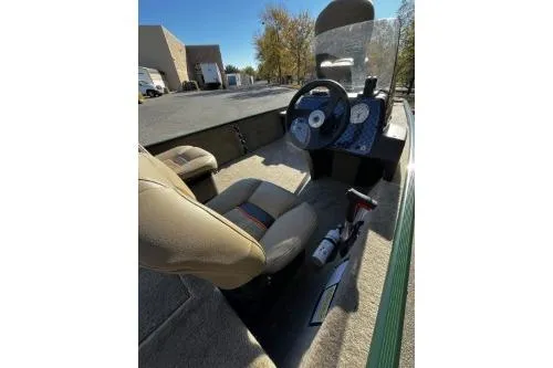 Slide: The Image of 2026 Tracker Bass Tracker Classic Limited boat interior with steering wheel and seating. - 7