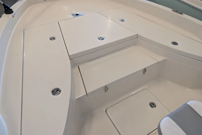 Slide: The Image of 2026 Ranger 2510 Bay boat interior with storage compartments and seating. - 7