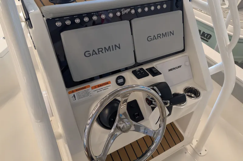 Slide: The Image of 2026 Ranger 2510 Bay boat console with dual Garmin displays and Mercury controls. - 6