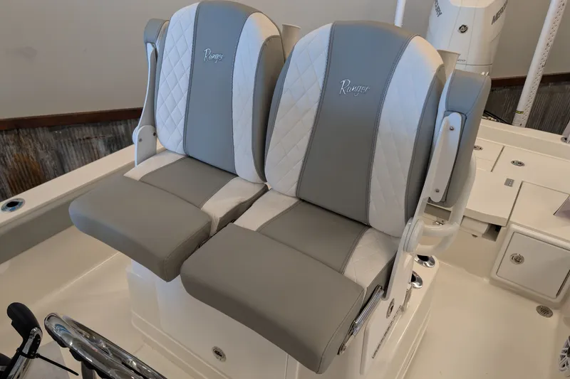 Slide: The Image of 2026 Ranger 2510 Bay boat seats with gray and white upholstery, featuring Ranger logo. - 5