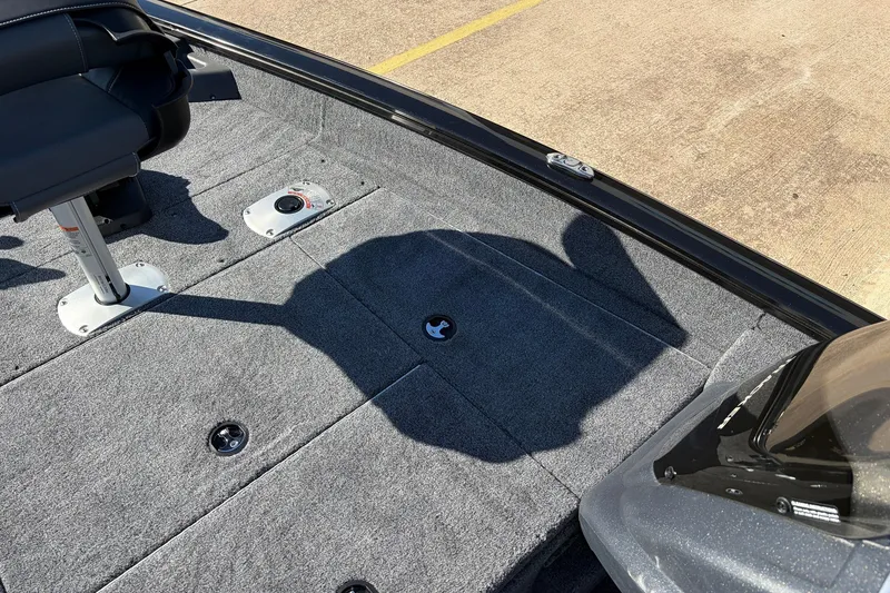 Slide: The Image of 2026 Tracker Pro Team 175 Crappie Edition boat interior with seating and carpeted deck. - 16