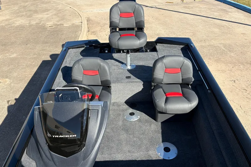 Slide: The Image of 2026 Tracker Pro Team 175 Crappie Edition boat interior with three gray and red seats. - 21