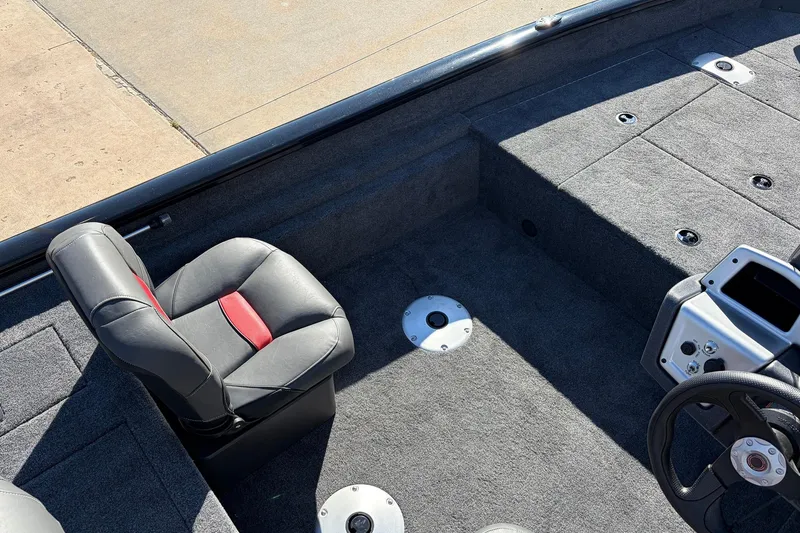 Slide: The Image of 2026 Tracker Pro Team 175 Crappie Edition boat interior with seating and steering wheel. - 22