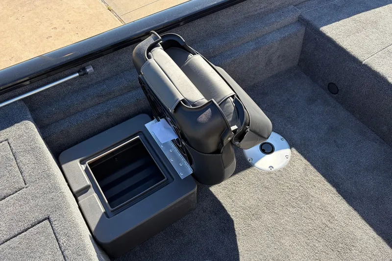 Slide: The Image of 2026 Tracker Pro Team 175 Crappie Edition boat interior with storage compartment and seat. - 24