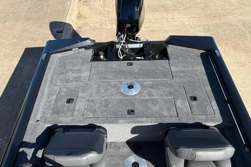 Slide: The Image of 2026 Tracker Pro Team 175 Crappie Edition boat interior with gray carpet and seating. - 27