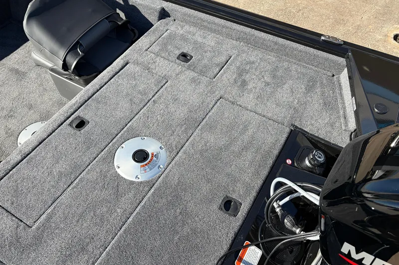 Slide: The Image of 2026 Tracker Pro Team 175 Crappie Edition boat interior with gray carpet and seating. - 32