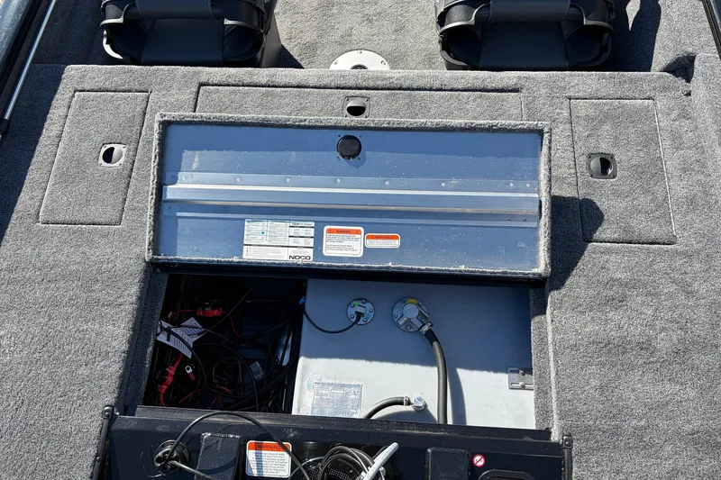 Slide: The Image of 2026 Tracker Pro Team 175 Crappie Edition boat interior with open storage compartment. - 35
