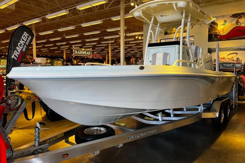 The Image of 2026 Ranger 2360 Bay boat displayed indoors on a trailer. - 0