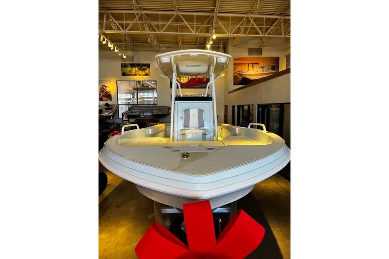 Slide: The Image of 2026 Ranger 2360 Bay boat displayed indoors with a red bow. - 1