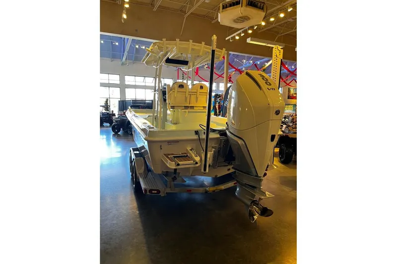 Slide: The Image of 2026 Ranger 2360 Bay boat with powerful V8 engine displayed indoors. - 2