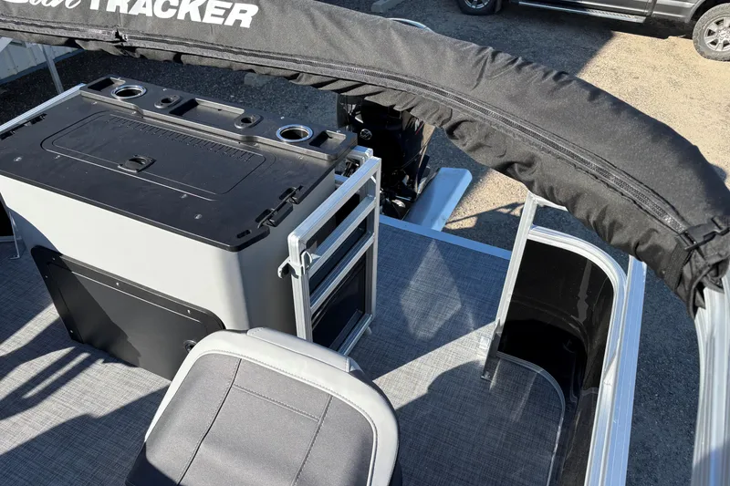 Slide: The Image of 2026 Sun Tracker SportFish 22 XP3 boat interior with seating and storage compartments. - 14