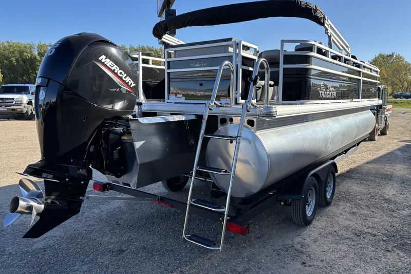 Slide: The Image of 2026 Sun Tracker SportFish 22 XP3 pontoon boat with Mercury outboard engine. - 3