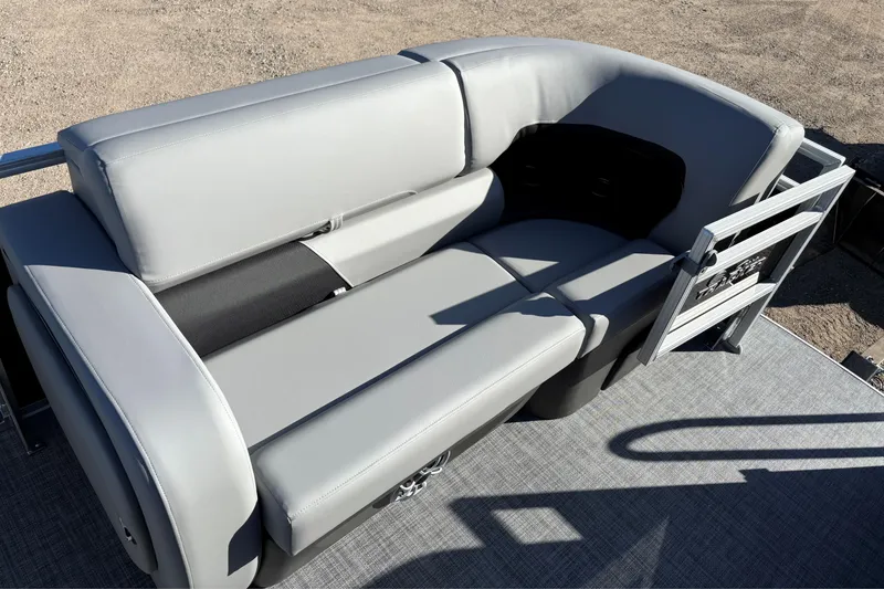 Slide: The Image of 2026 Sun Tracker SportFish 22 XP3 boat seating with gray upholstery and spacious layout. - 8