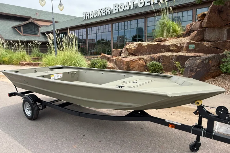 Slide: The Image of 2026 Tracker Grizzly 1648 Utility boat on trailer outside Tracker Boat Center. - 5