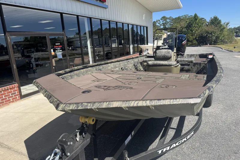 Slide: The Image of 2026 Tracker Grizzly 2072 CC boat on trailer outside dealership. - 7
