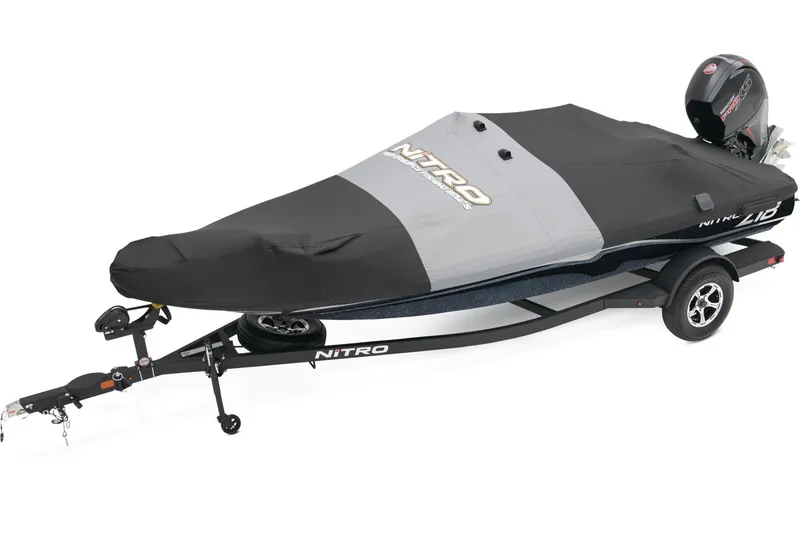 Slide: The Image of 2026 Nitro Z18 Pro boat interior with red and gray seats, steering wheel, and Mercury engine. - 7