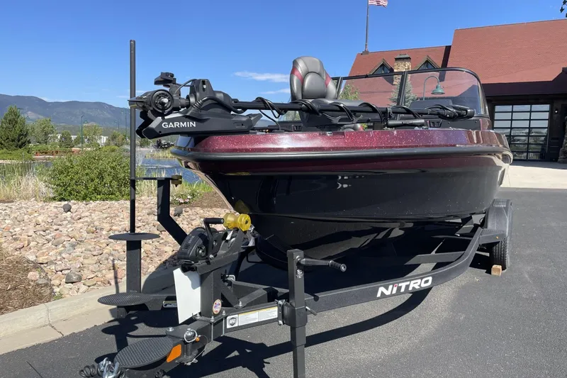Slide: The Image of 2026 Nitro ZV20 Pro boat on trailer, featuring Garmin equipment, parked outdoors. - 63