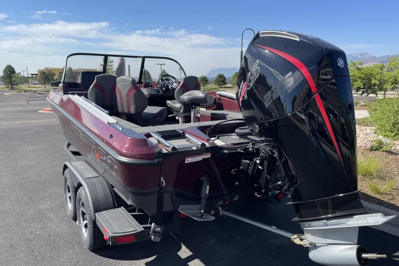 Slide: The Image of Nitro ZV20 Pro 2026 boat with powerful outboard motor, parked on a sunny day. - 64