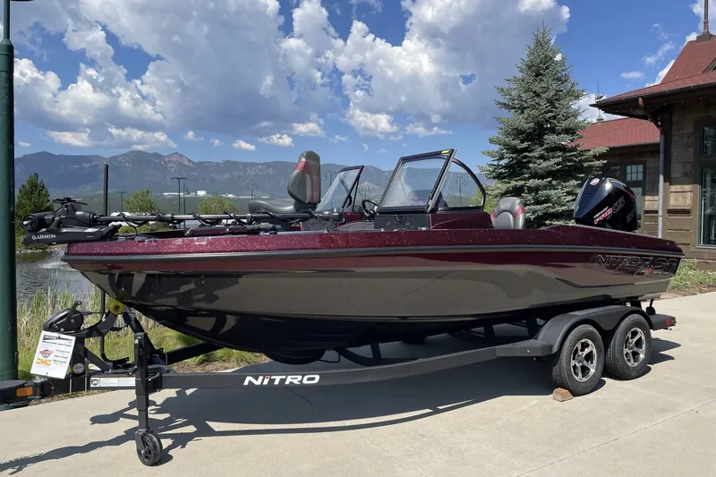 The Image of 2026 Nitro ZV20 Pro fishing boat on trailer, scenic mountain backdrop. - 0