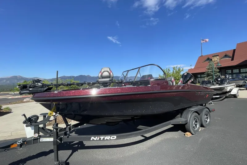 Slide: The Image of 2026 Nitro ZV20 Pro boat on trailer, parked outdoors under clear blue sky. - 65