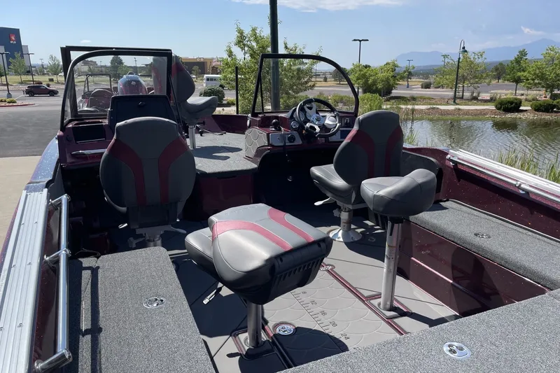 Slide: The Image of Interior of a 2026 Nitro ZV20 Pro boat with seating and steering console. - 3