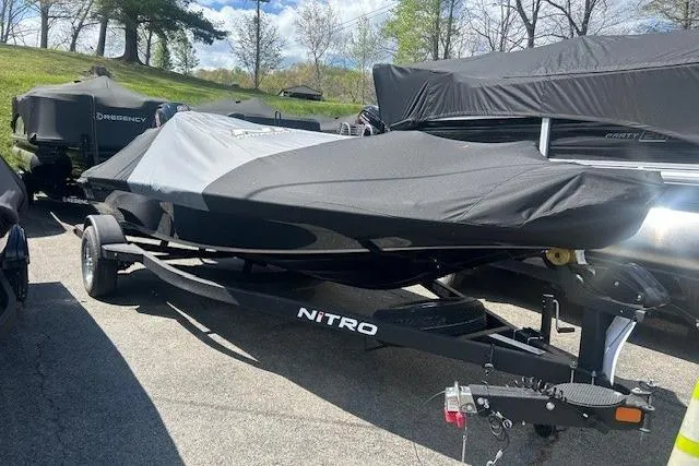 Slide: The Image of Covered Nitro Z18 Pro boat on trailer, 2026 model, parked outdoors. - 93