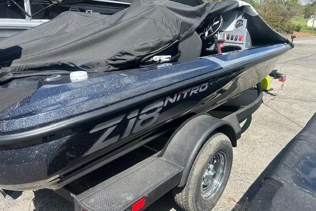 Slide: The Image of 2026 Nitro Z18 Pro boat on trailer, covered and parked outdoors. - 95
