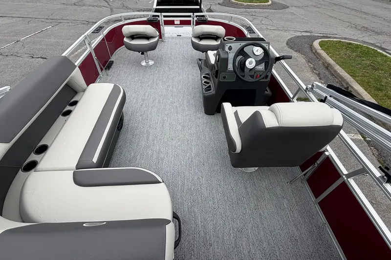Slide: The Image of 2026 Sun Tracker Bass Buggy 16 XL Select pontoon boat interior with seating and steering console. - 4
