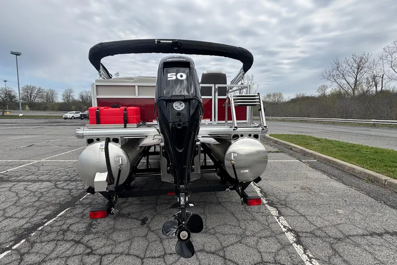 Slide: The Image of 2026 Sun Tracker Bass Buggy 16 XL Select pontoon boat with Mercury 50 HP engine. - 3