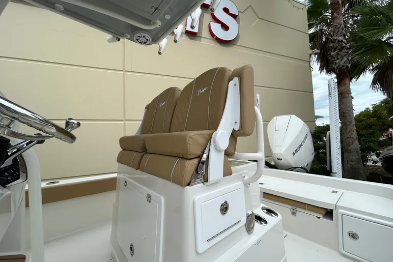 Slide: The Image of 2026 Ranger 2360 Bay boat with tan seating and Mercury outboard motor. - 9