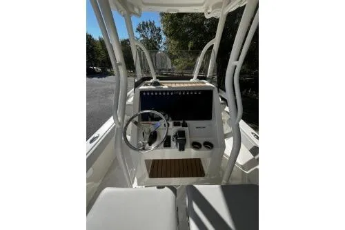 Slide: The Image of 2026 Ranger 2360 Bay boat console with steering wheel and controls. - 5