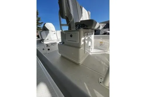 Slide: The Image of 2026 Ranger 2360 Bay boat interior with seating and storage under clear blue sky. - 7