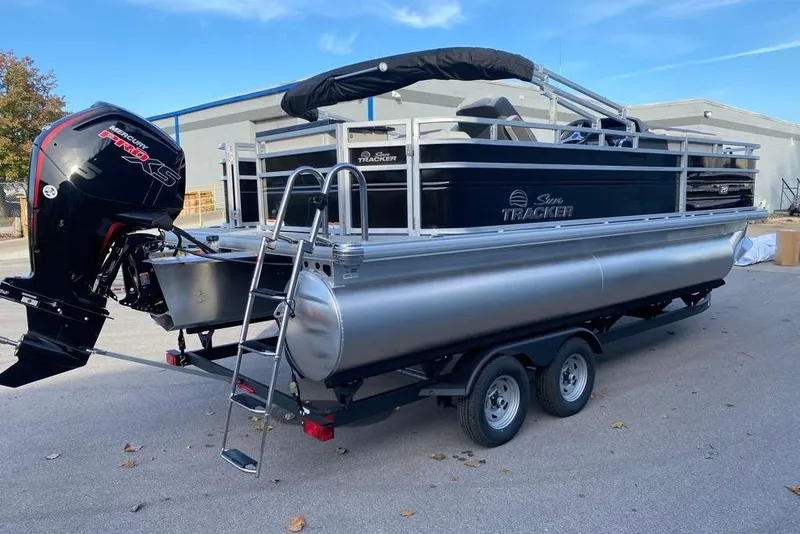 Slide: The Image of 2026 Sun Tracker Fishin' Barge 20 DLX pontoon boat with Mercury engine on trailer. - 104