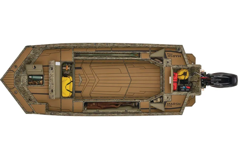 Slide: The Image of 2026 Tracker Grizzly 1756 T Marsh boat displayed outdoors near a building. - 7