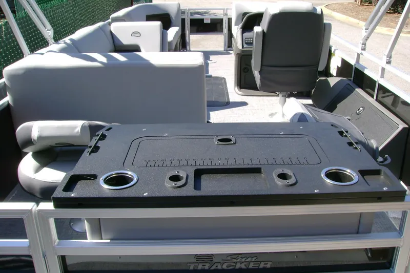 Slide: The Image of 2026 Sun Tracker SportFish 22 XP3 pontoon boat interior with seating and fishing station. - 6