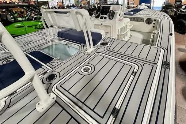 Slide: The Image of 2026 Mako 18 Pro Skiff Patriot Edition boat interior with sleek design and seating. - 11