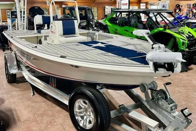 Slide: The Image of 2026 Mako 18 Pro Skiff Patriot Edition on display in showroom. - 3