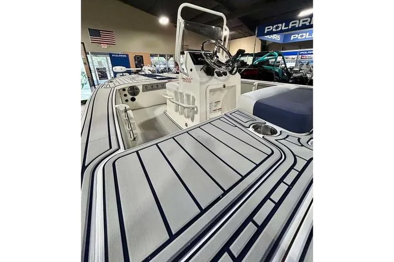Slide: The Image of 2026 Mako 18 Pro Skiff Patriot Edition boat interior with sleek design and modern controls. - 9