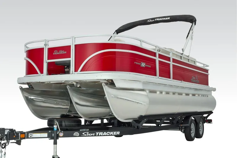 Slide: The Image of 2026 Sun Tracker Fishin' Barge 22 XP3 interior with steering console and seating. - 18