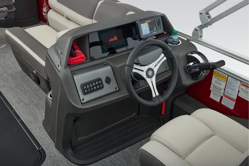 Slide: The Image of 2026 Sun Tracker Fishin' Barge 22 XP3 interior with seating and control console. - 38