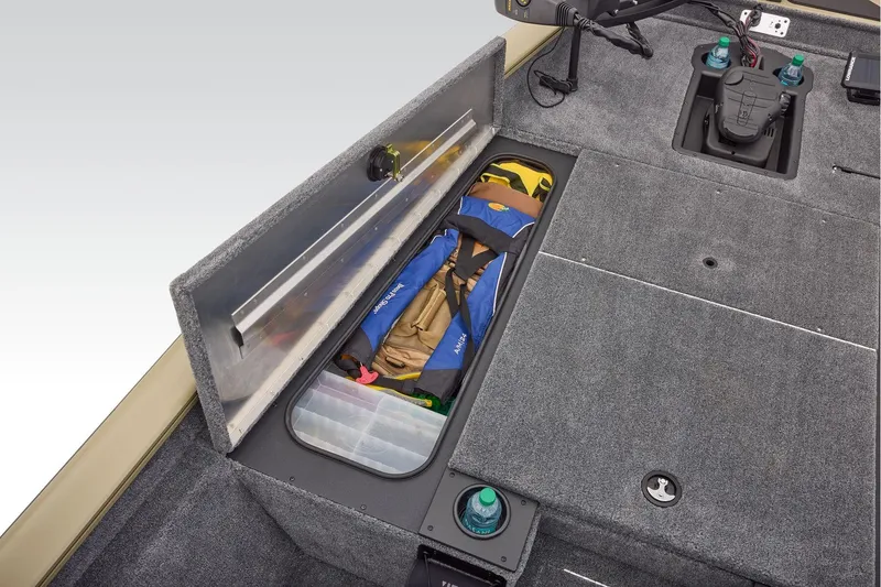 Slide: The Image of 2026 Tracker Pro Team 175 boat interior with open storage compartment and cushioned seating. - 20