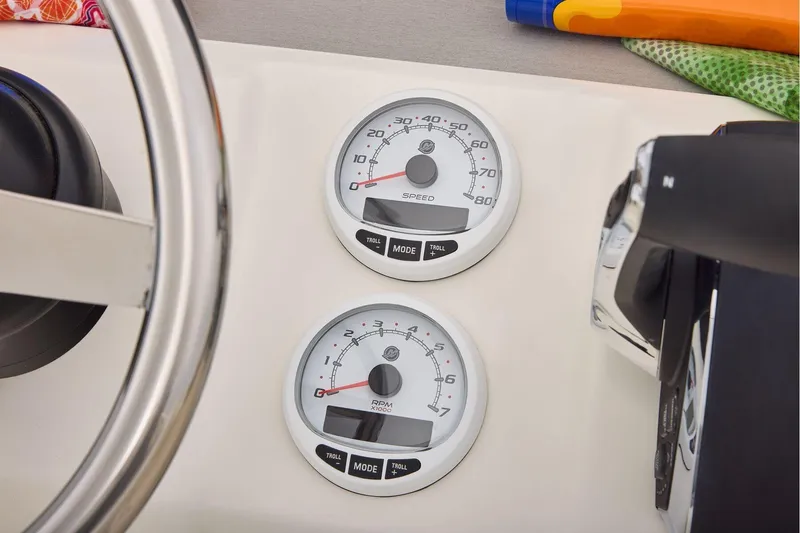 Slide: The Image of Dashboard of 2026 Mako 24 APEX boat with speed and RPM gauges. - 39