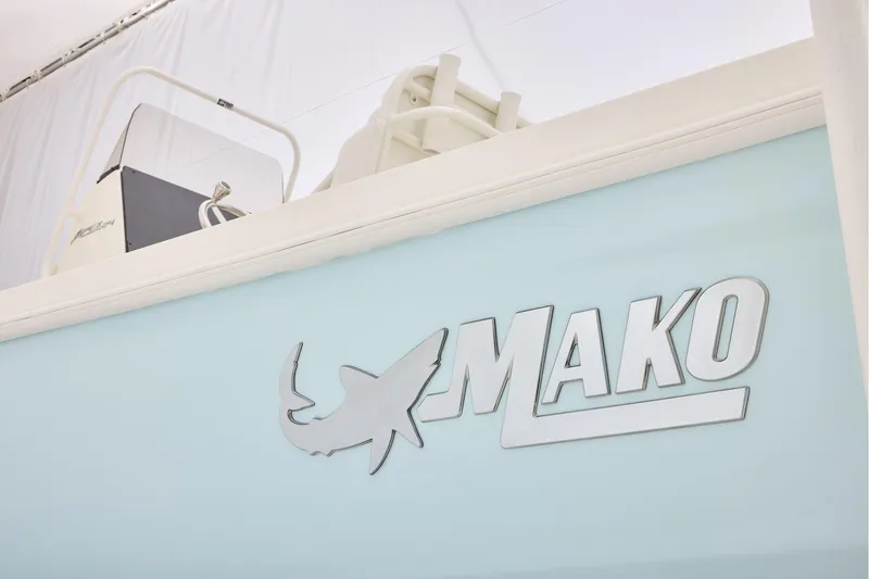 Slide: The Image of 2026 Mako 24 APEX boat logo on light blue background. - 58