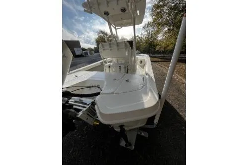 Slide: The Image of 2026 Mako 24 APEX boat, white deck, outdoor setting, sunny day. - 6