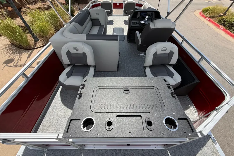 Slide: The Image of 2026 Sun Tracker Fishin' Barge 22 XP3 interior with seating and fishing amenities. - 15