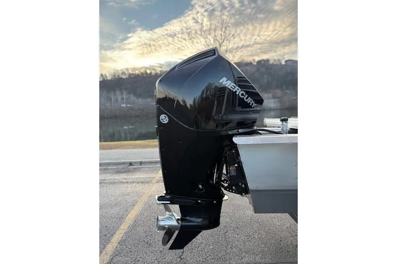 Slide: The Image of 2026 Sun Tracker SportFish 22 XP3 with Mercury outboard motor, scenic background. - 15