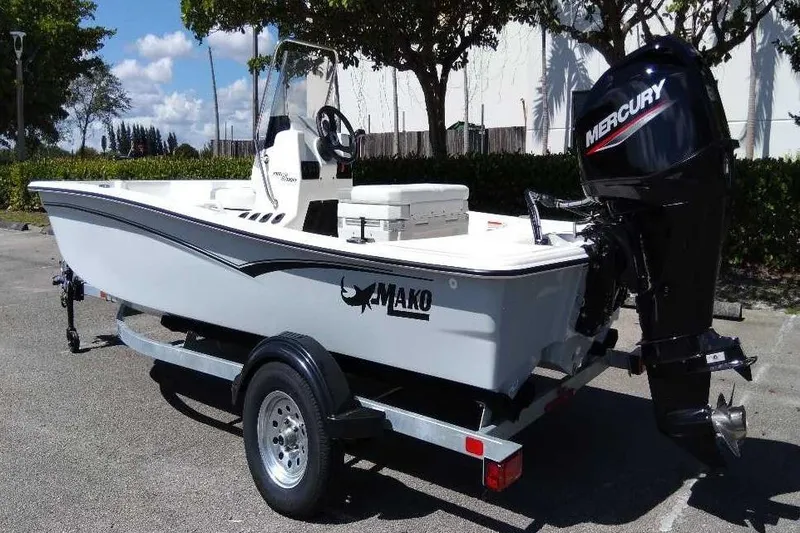 Slide: The Image of 2026 Mako Pro Skiff 15 CC boat on trailer in parking lot. - 6