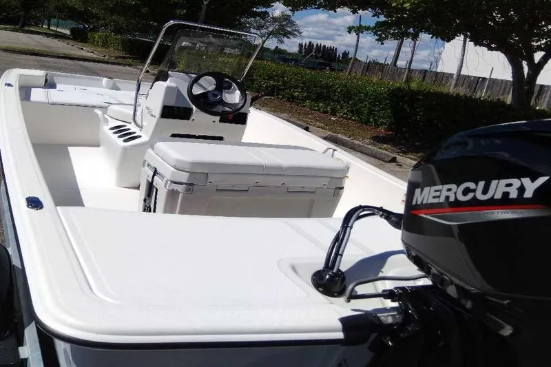 Slide: The Image of 2026 Mako Pro Skiff 15 CC boat on trailer with Mercury outboard motor. - 7