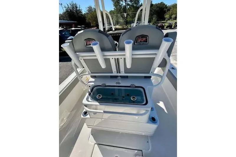 Slide: The Image of 2026 Ranger 2360 Bay boat interior with rod holders and seating. - 13